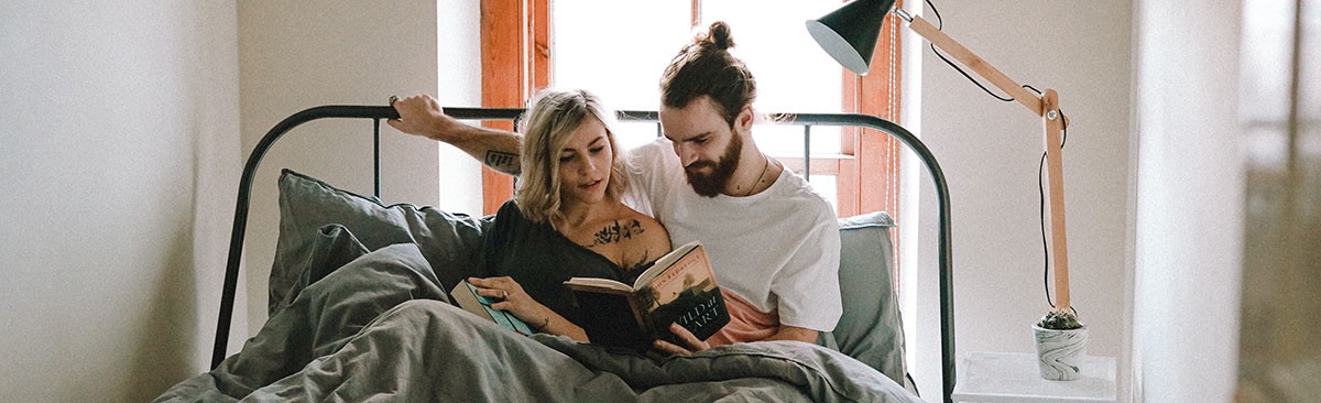 couple reading book about anal sex