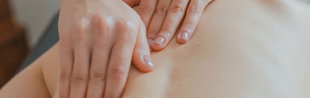 man giving erotic massage to woman